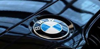 BMW cuts east German working hours to same as west