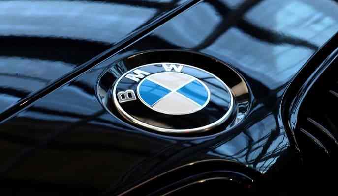 BMW cuts east German working hours to same as west BMW cuts east German working hours to same as west