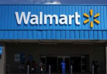 Walmart cuts paid leave in half for COVID- 19 positive workers