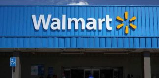 Walmart cuts paid leave in half for COVID- 19 positive workers