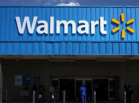 Walmart cuts paid leave in half for COVID- 19 positive workers