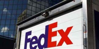 FedEx to close stores, put off hiring as demand slumps